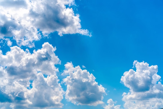 Beautiful white clouds on a bright blue background