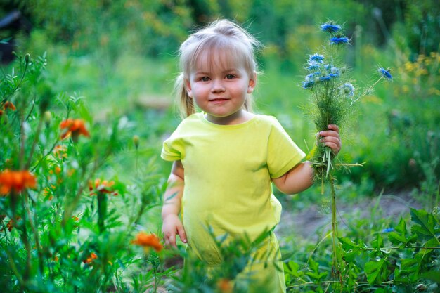 Beautiful white girl with a smile and a bouquet of flowers, toned