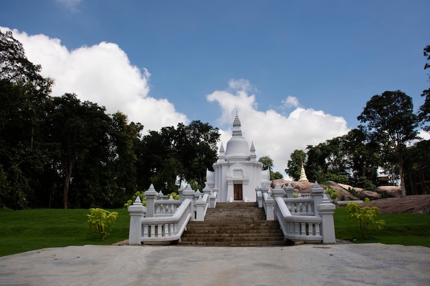 Beautiful White Stupa Shrine at outdoor garden in Wat Tham Klong phen forest temple for Thai people and foreign travelers travel visit respect praying at Phu Phan mountain in Nong Bua Lamphu Thailand