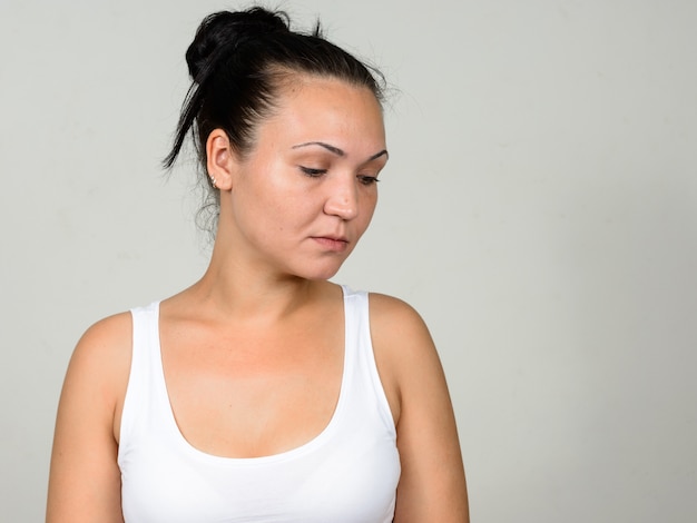  beautiful woman against white wall