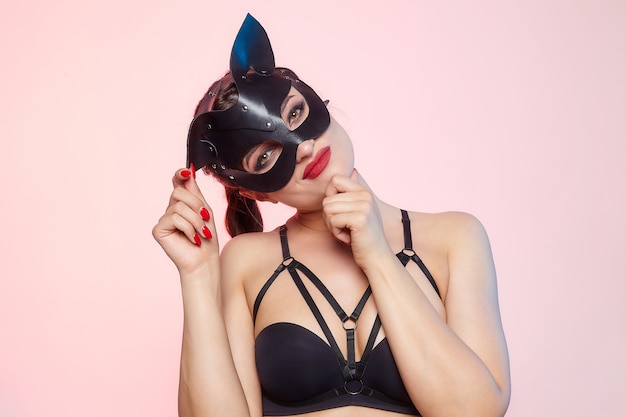 Beautiful woman in a cat mask.