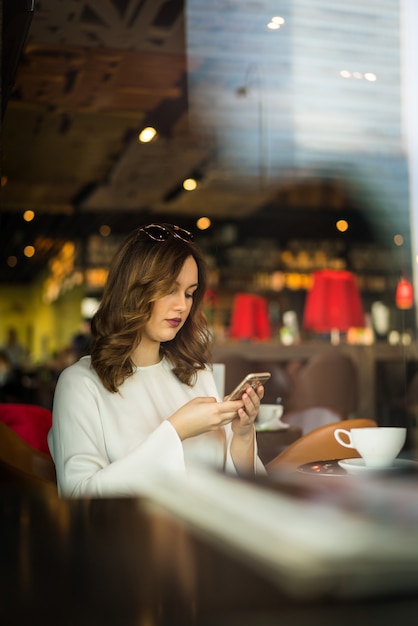 Beautiful, woman chatting with her phone