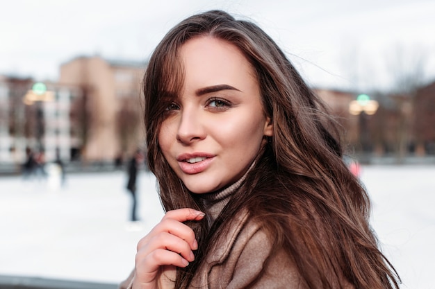 Beautiful woman closeup winter cold weather outdoor street portrait