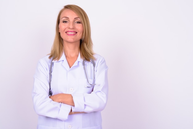 beautiful woman doctor with blond hair against white space