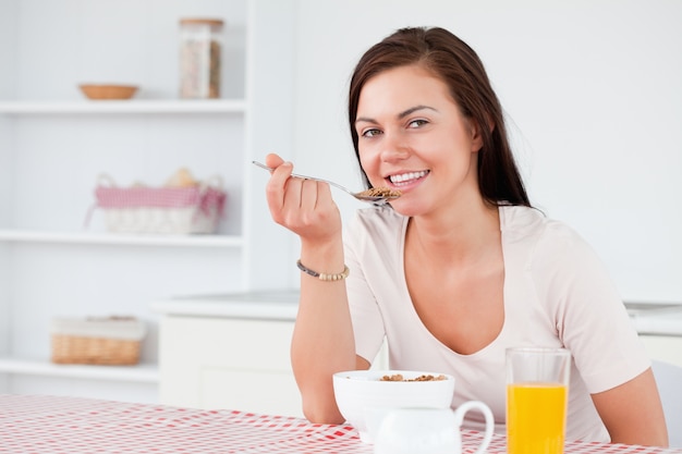 Beautiful woman eating her cereal