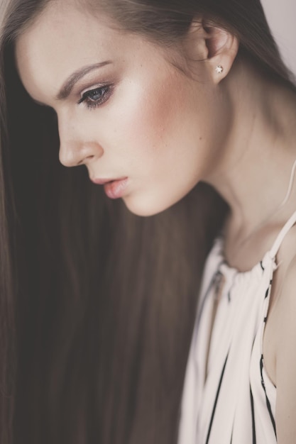 Beautiful woman face close up studio on white