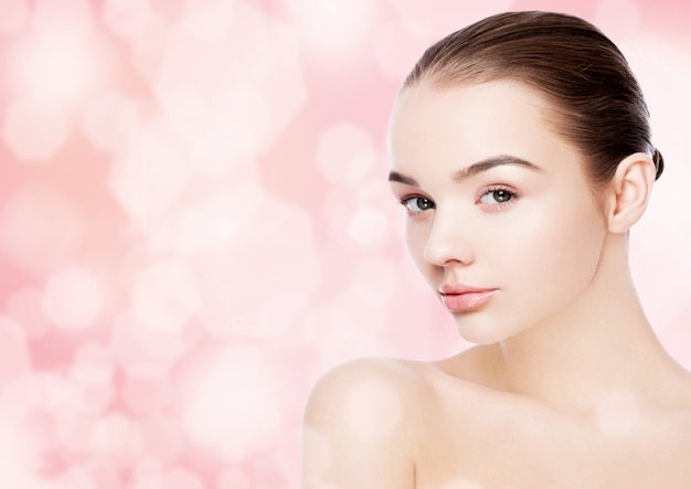 Beautiful woman girl natural makeup spa skin care portrait on pink bokeh background