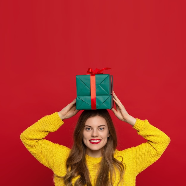 Beautiful Woman holding Christmas present