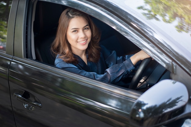 Beautiful woman is driving her car 