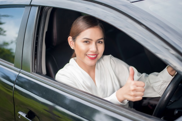 Beautiful woman is driving her car