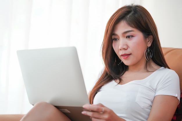 A beautiful woman is working at home