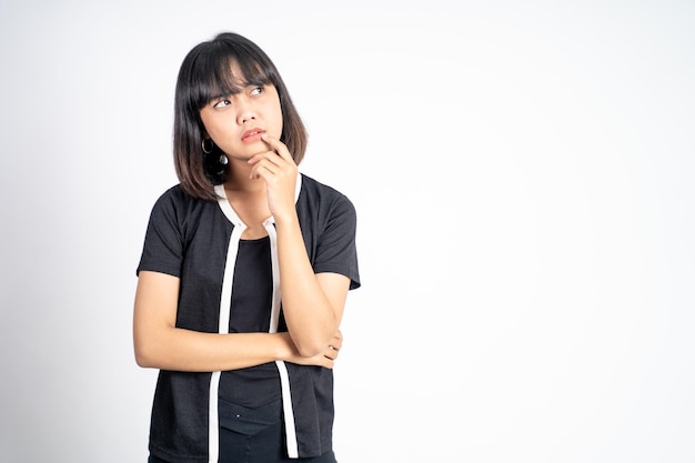 Beautiful woman on isolated background with thoughtful expression