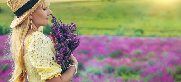 Beautiful woman in lavender field Selective focus