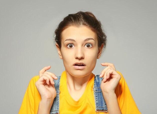 Beautiful woman posing on gray background