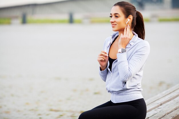 Beautiful woman practicing fitness outdoors