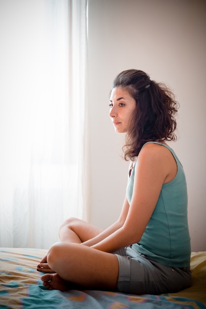 beautiful woman reading in bed