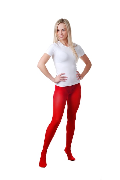 Beautiful woman in red tights at white background