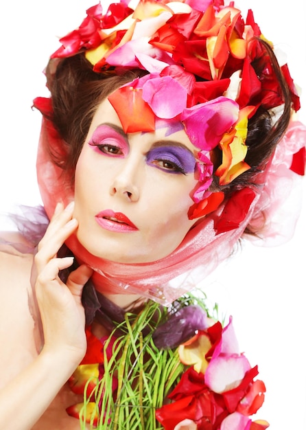 Beautiful Woman's Face and rose petals