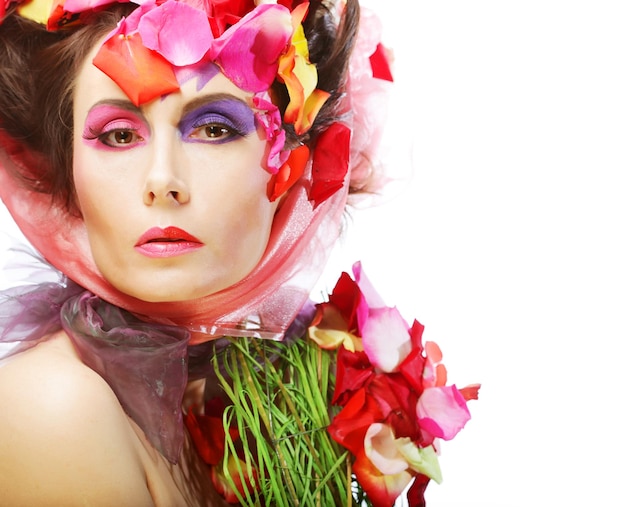 Beautiful Woman's Face and rose petals