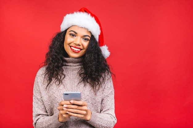 Beautiful woman in Santa Claus hat