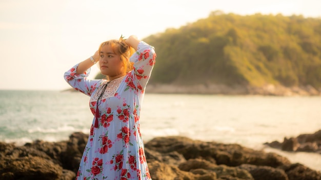 beautiful woman and the sea in the evening