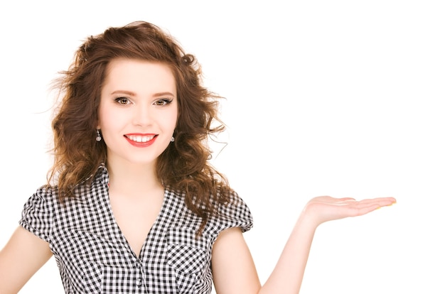 beautiful woman showing something on the palm of her hand