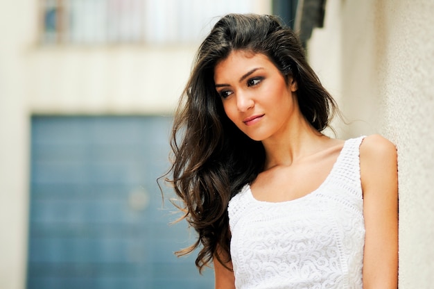 Beautiful woman smiling in urban background