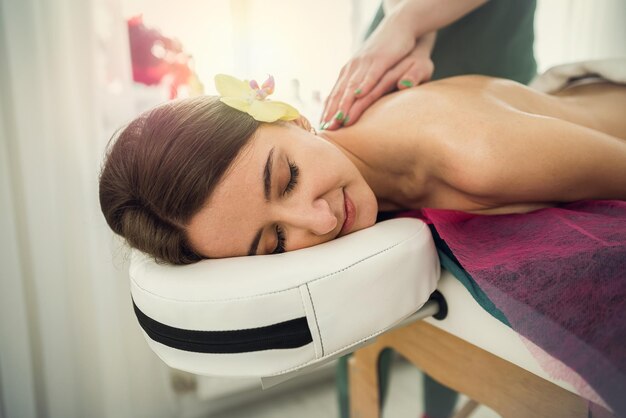 Beautiful woman in spa salon