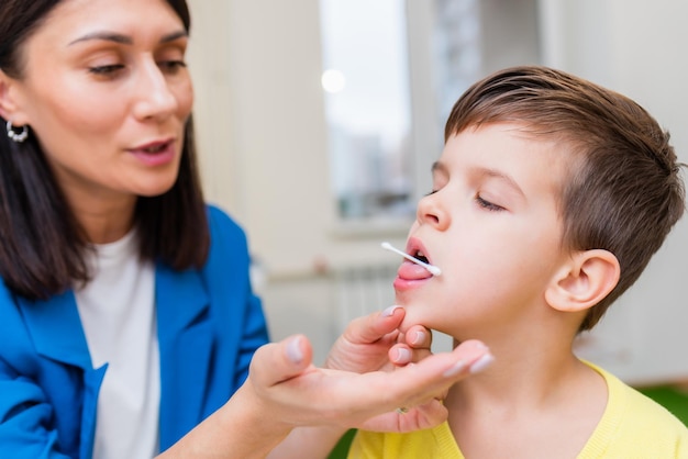 A beautiful woman speech therapist deals with the boy and teaches him the correct pronunciation and competent speech.