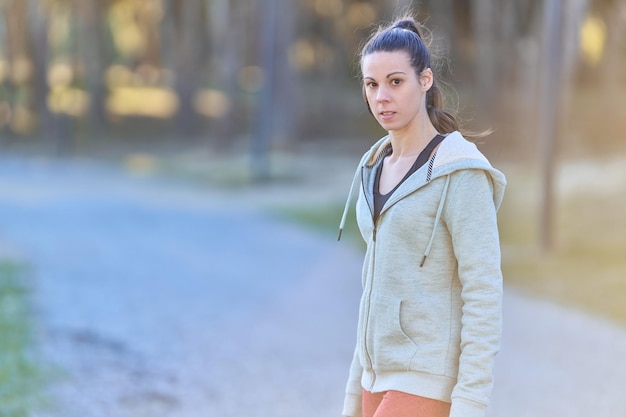 Beautiful woman in sportswear looking at the camera