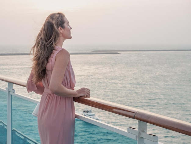 Beautiful woman standing on the empty deck