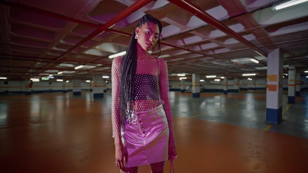 Beautiful woman standing neon parking trendy outfit closeup young girl posing