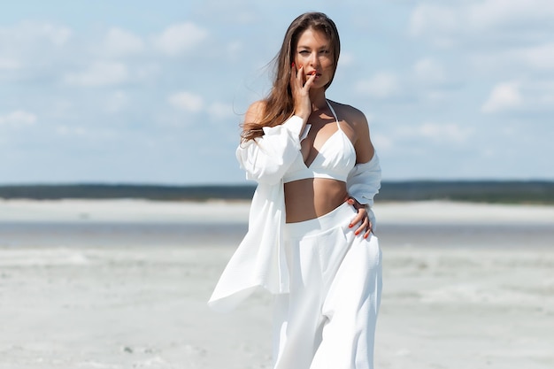 Beautiful woman standing on seashore