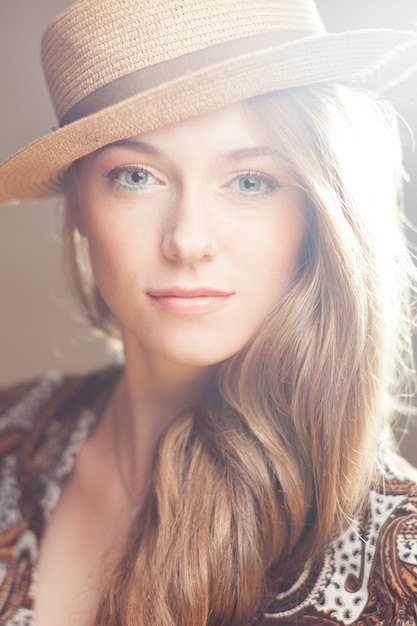 Beautiful woman in a straw hat