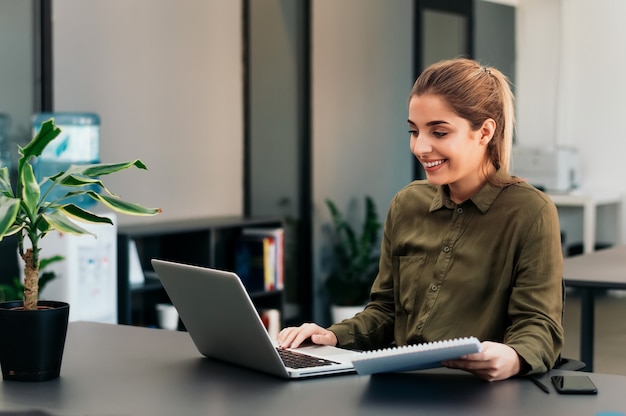 Beautiful woman studying online at home.