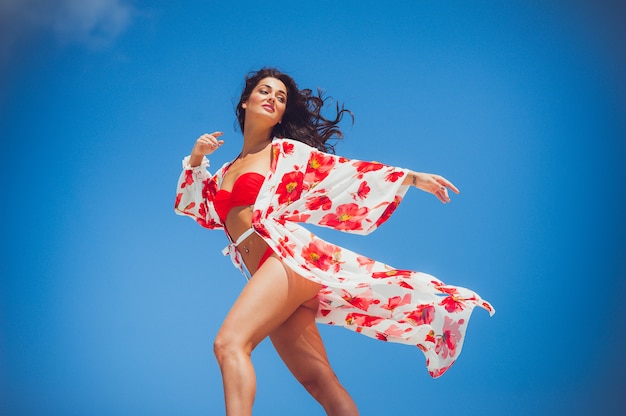 Beautiful woman summer swimwear on the sand