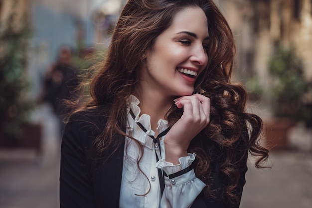 Beautiful woman walks at Istiklal streeta popular location in Beyoglu districtIstanbulTurkey walking on Istanbul street and enjoy arabic city architecture