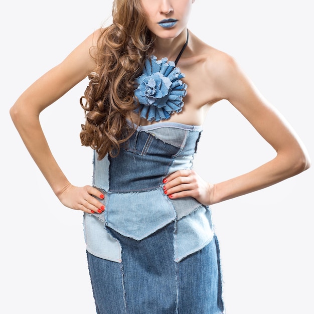 Beautiful woman wearing dress from old jeans Recycle fashion concept