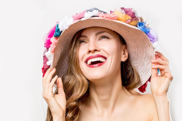 Beautiful woman wearing floral hat