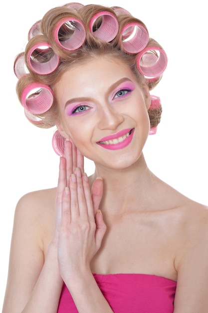 Beautiful woman wearing pink dress isolated on white background