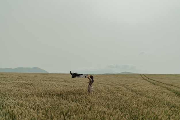 Beautiful woman wheat fields windy day in Spain