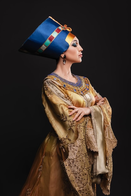 Beautiful woman with brown eyes and evening makeup as Queen Nefertiti