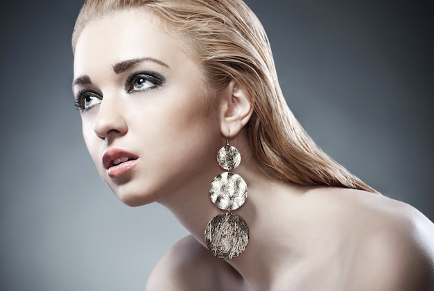 Beautiful woman with evening make-up. Jewelry and Beauty. Fashion photo