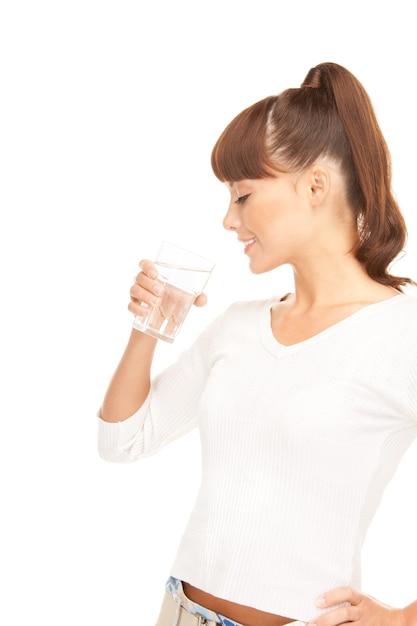 beautiful woman with glass of water over white