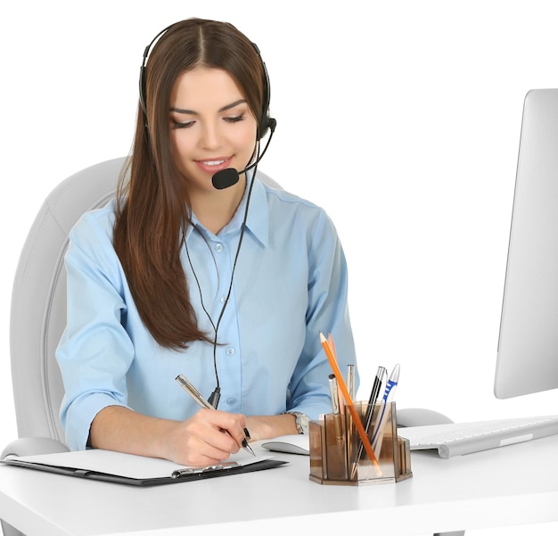 A beautiful woman with headphones and microphone working at the office isolated on white