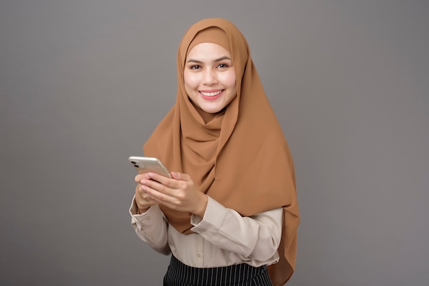 Beautiful woman with hijab using the phone