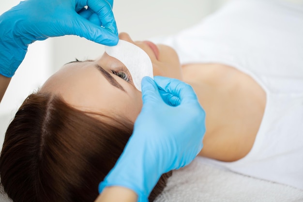 Beautiful Woman with long eyelashes in a beauty salon