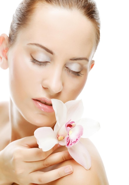 Beautiful woman with orchid flower