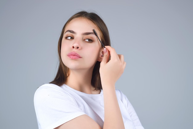 Beautiful woman with perfect shape eyebrows womans brows close up beautiful girl with eyebrow brush