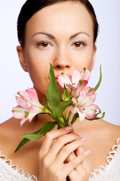 Beautiful woman with pink flower